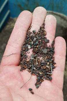 Magnetic grate separator in housing MSS-AC in a chute of dry mortar mix