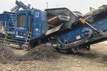 Self-cleaning magnetic plate for mobile crushers – separation of rebar during concrete crushing