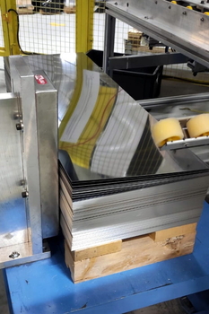 Magnetic sheet separator MC spreads apart the upper sheets of the stack