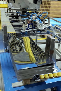 Magnetic sheet separator MC spreads apart the upper sheets of the stack