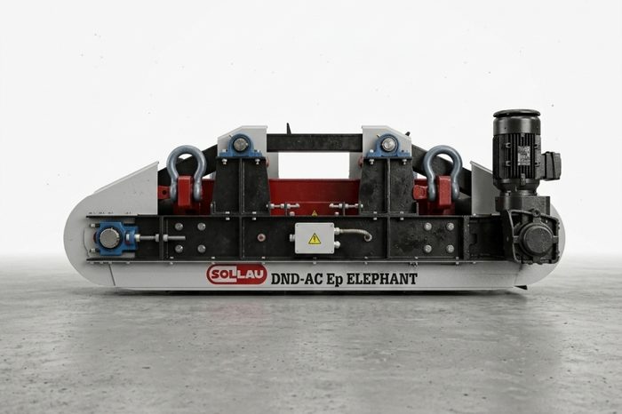 Suspended electromagnetic overband separator DND-AC-E above a conveyor belt